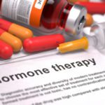 Hormone Therapy - Medical Concept with Red Pills, Injections and Syringe