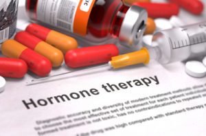 Hormone Therapy - Medical Concept with Red Pills, Injections and Syringe