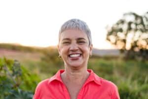 woman smiling in a field