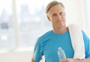 Mature man leaves the gym after completing his workout routine.