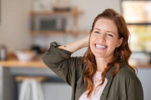 Woman in perimenopause smiling after hormone supplements in Brownwood, TX